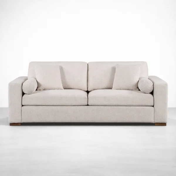 Beige 2 seater sofa front view with wide track arms and cushion set by INTERIORZE Luma