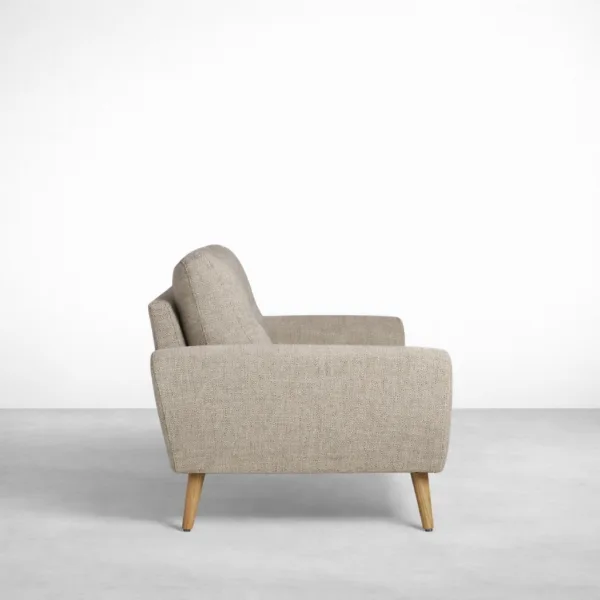 Beige 2 seater sofa side view with rounded arms and teakwood legs by INTERIORZE Soren
