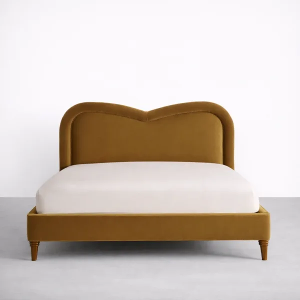 Front view of mustard velvet upholstered bed with heartback headboard INTERIORZE Aurelia