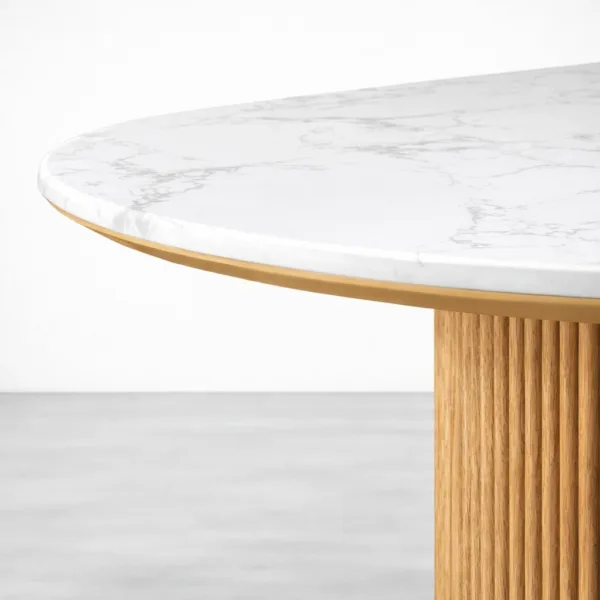 White marble edge detail on fluted teakwood dining table by INTERIORZE