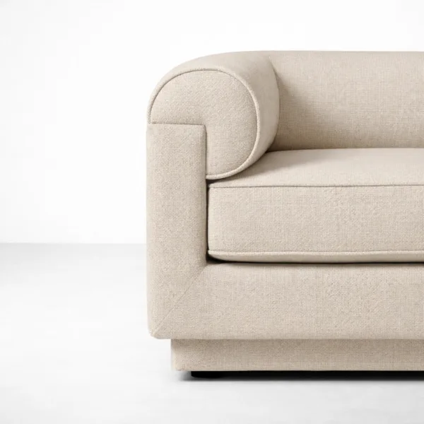 Close-up of roll-arm design on beige 2 seater sofa by INTERIORZE.