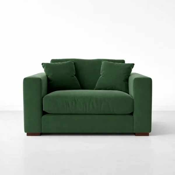 Green velvet lounge chair with teakwood legs front view with wide arms, INTERIORZE EVERGREEN.