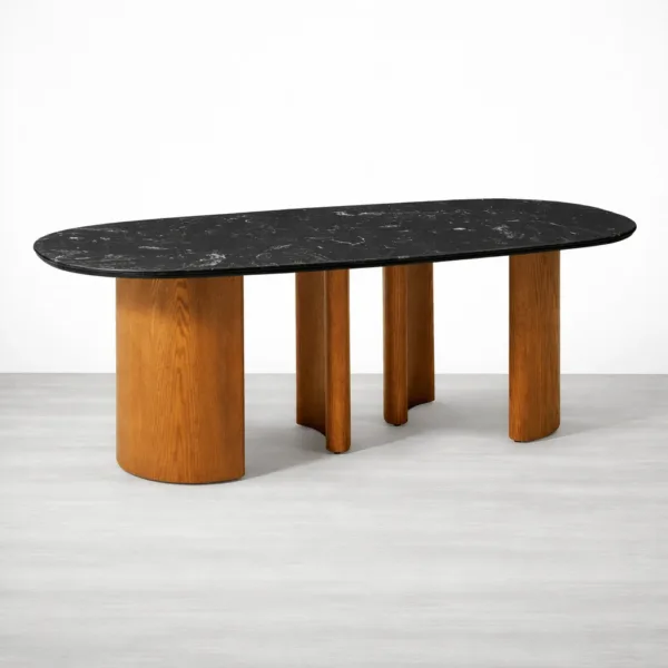 Oval black marble top dining table with teakwood base by INTERIORZE
