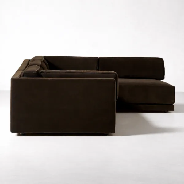 Close-up of INTERIORZE dark brown modular sectional sofa arm and cushion