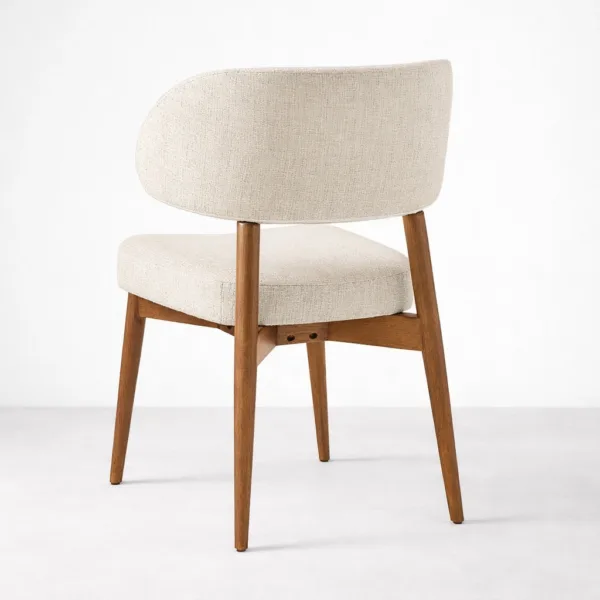 Beige upholstered dining chair back angle view with teakwood frame walnut polish