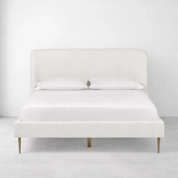 Bouclé upholstered bed with wraparound headboard in off-white fabric by INTERIORZE