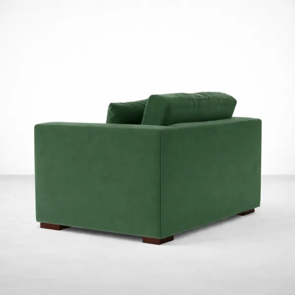 Green velvet lounge chair with teakwood legs rear angle view, INTERIORZE EVERGREEN.