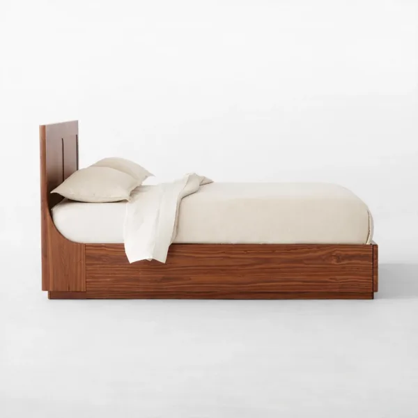Side view of INTERIORZE Arvon teakwood storage bed with panel headboard