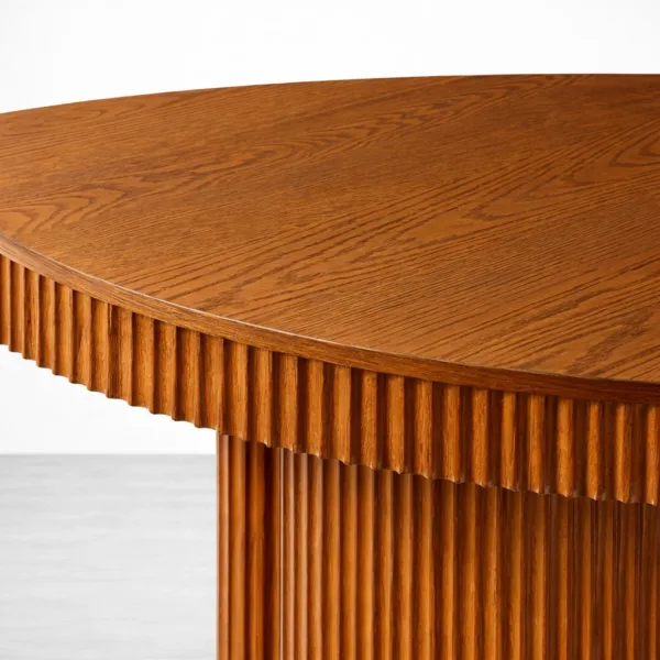 Solid teakwood tabletop close-up of round fluted teakwood dining table