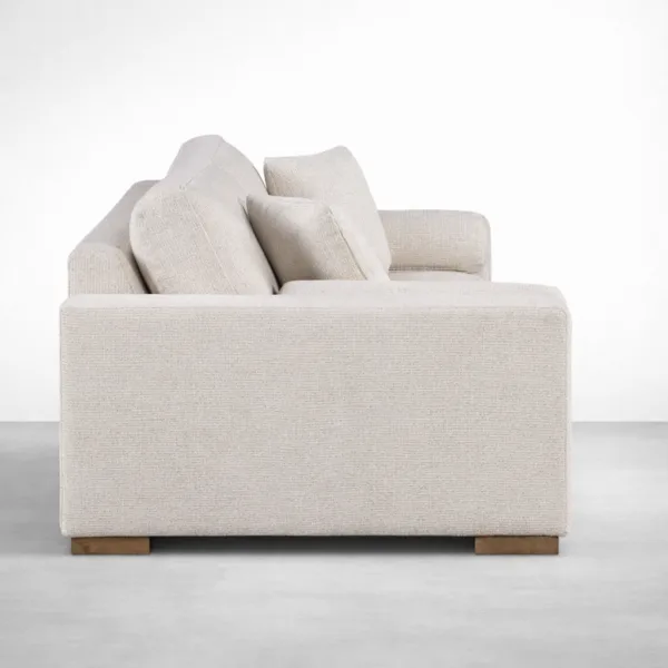 Beige 2 seater sofa side view with wide track arms and deep cushions by INTERIORZE Luma