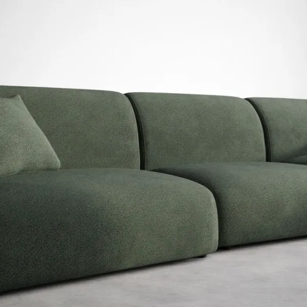 Close-up of forest green fabric upholstery on modular sofa