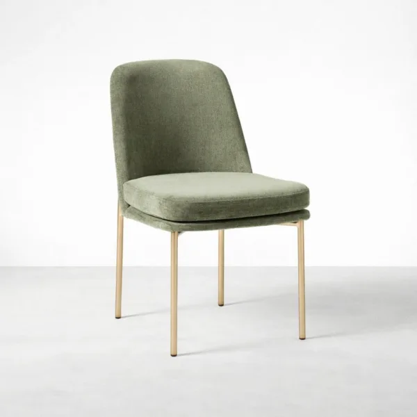 Sage green upholstered dining chair with gold metal frame angled view INTERIORZE Aurora