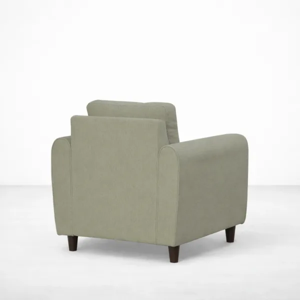 Sage green armchair with teakwood legs angled view, INTERIORZE ELM.