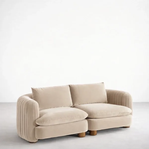 Angled view of Arcura 2 seater teakwood sofa in ivory upholstery by INTERIORZE