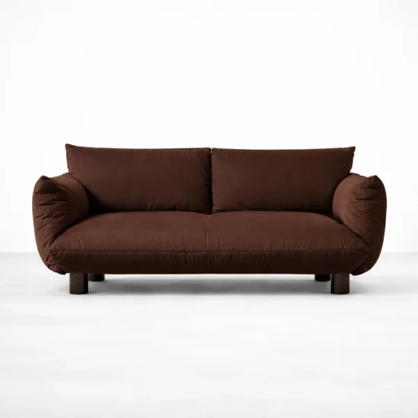 Front view of INTERIORZE Cocoa Loft brown suede fabric 2 seater sofa with plush cushions, rounded side bolsters, and wooden legs