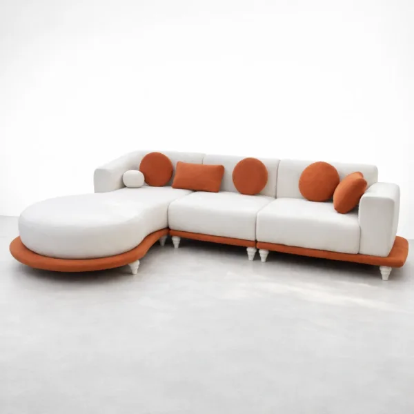 Curved chaise sectional sofa with off-white upholstery and rust orange accent cushions, front view