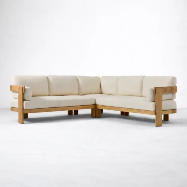 Corner seat view of teakwood L shape sectional sofa with ivory fabric cushions