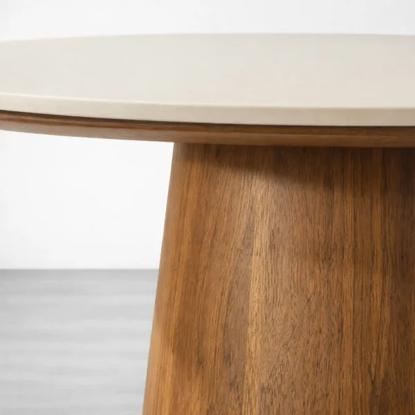 Close-up of the marble-look round top edge on Aurora dining table