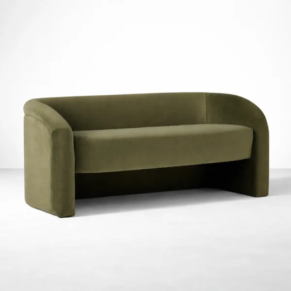 Angled view of INTERIORZE Olive Arc olive green velvet 2 seater sofa showing wrap-around arms, wide seat, and open base