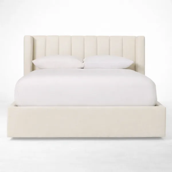 Ivory upholstered bed with teakwood frame and channel wing headboard front view