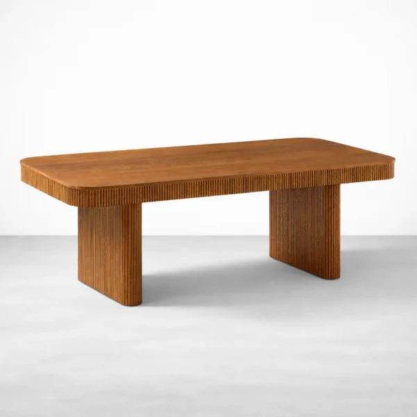 Angled view of INTERIORZE Rillan fluted teakwood dining table