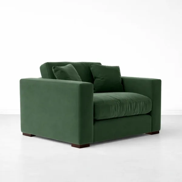 Green velvet lounge chair with teakwood legs angled view, INTERIORZE EVERGREEN.