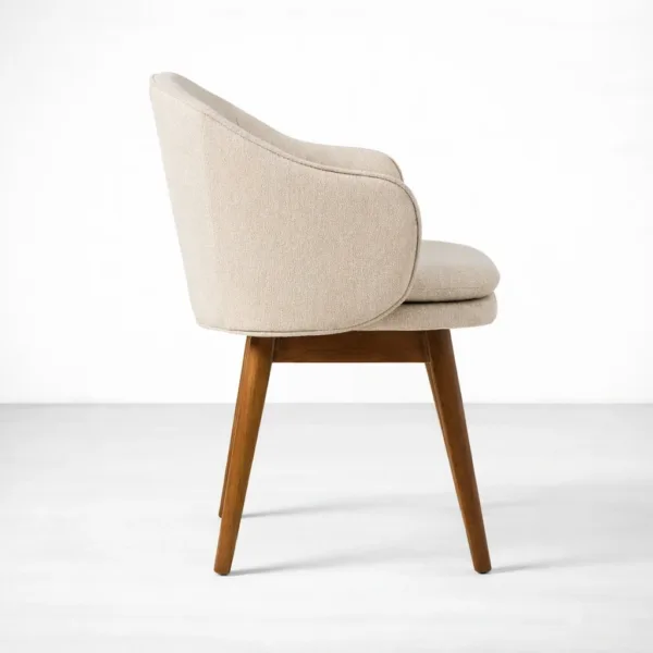 Side profile of teak Dining chair with curved tub back and ivory bouclé upholstery