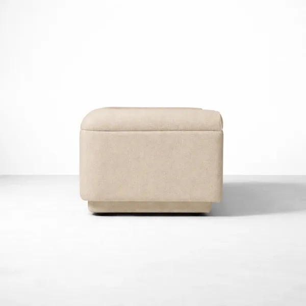 Side view of matching beige upholstered ottoman for 2 seater sofa.