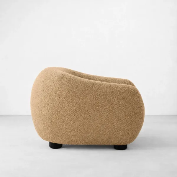 Beige boucle lounge chair with teakwood legs side view, INTERIORZE SANDDUNE.