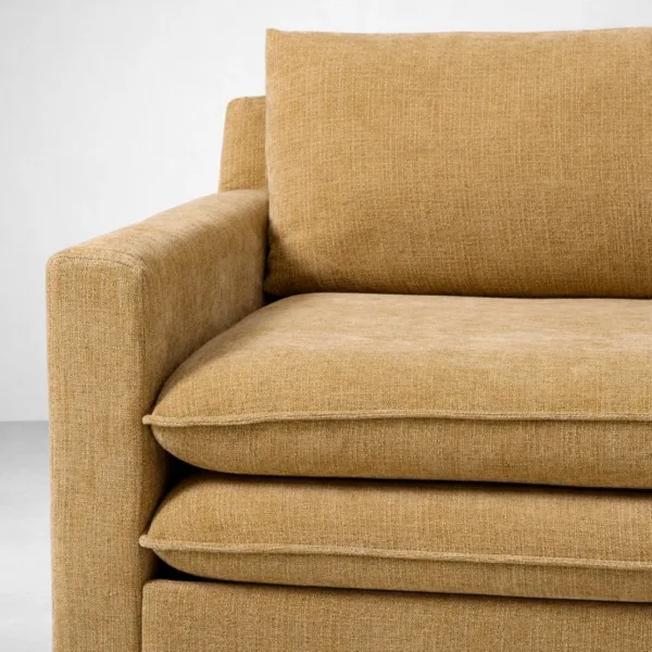 Mustard textured upholstery fabric close-up on Aster sofa cum bed by INTERIORZE