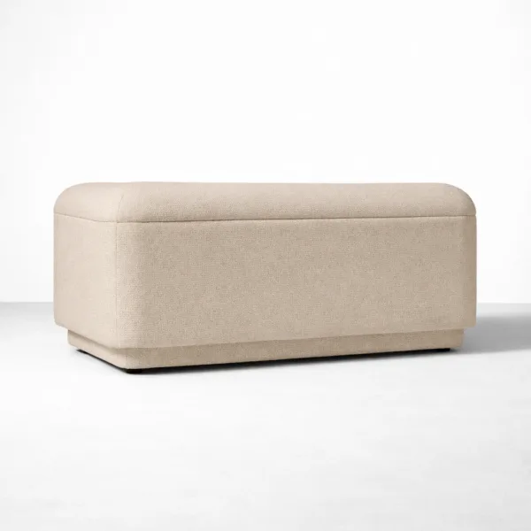 Angled view of matching beige ottoman designed for INTERIORZE Oslo sofa