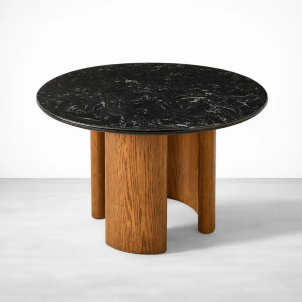 Angled view of Obsidia black marble top round dining table with teakwood base