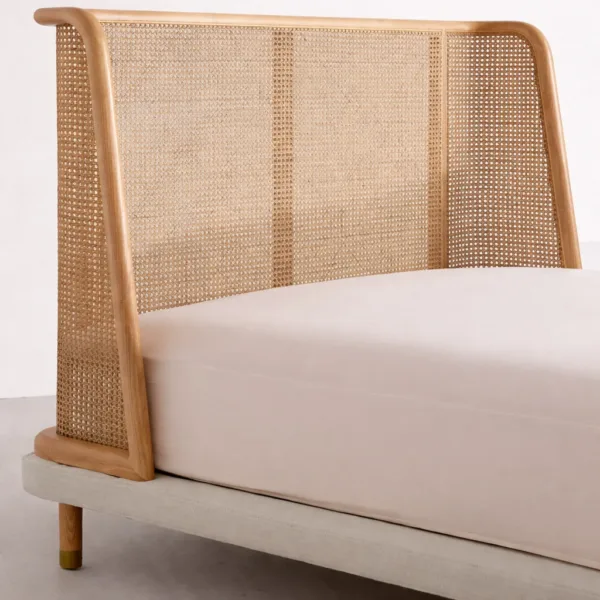 Teakwood cane bed headboard close-up showing handwoven cane and curved teak frame