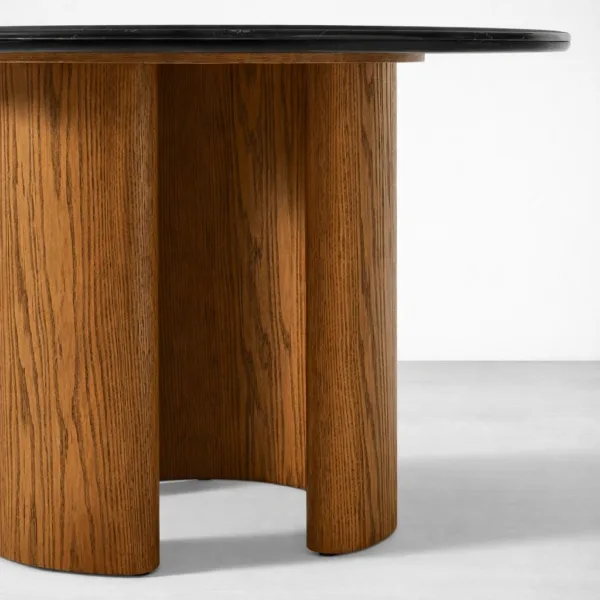 Teakwood base detail of Obsidia black marble top round dining table