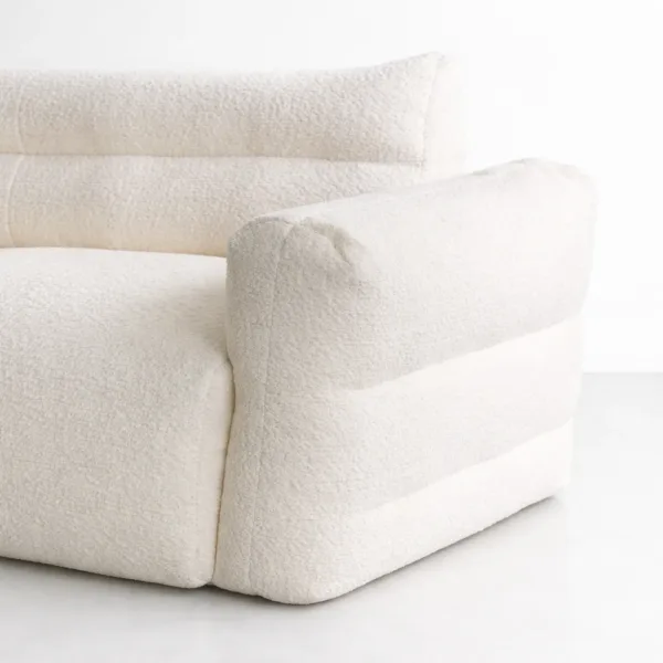 Close-up of INTERIORZE Cloudline ivory boucle 2 seater sofa showing rounded arm and textured upholstery