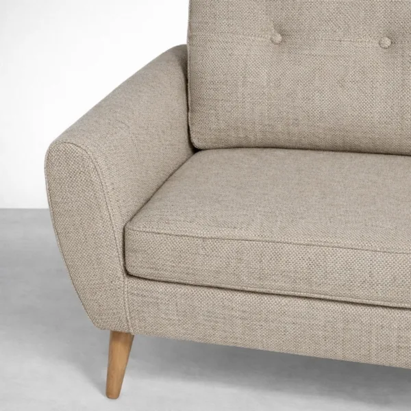 Beige sofa fabric and seat cushion close-up detail with teakwood leg by INTERIORZE