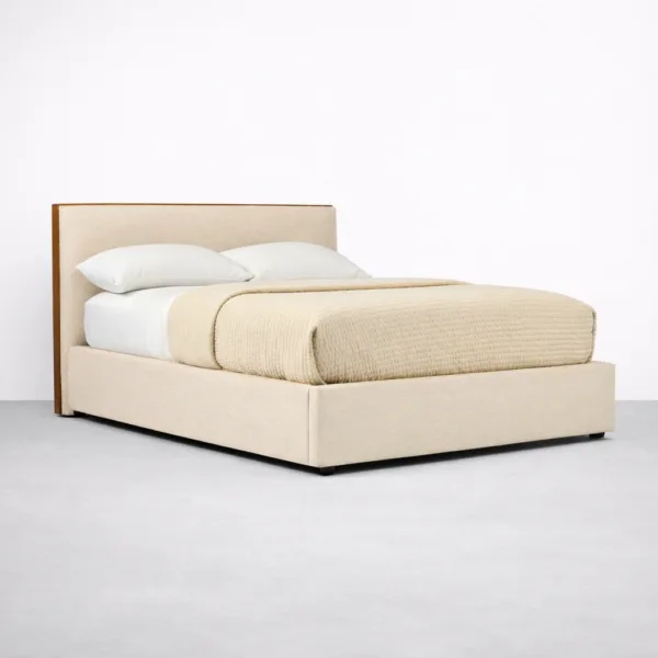 Front view of beige upholstered teakwood bed frame with padded headboard