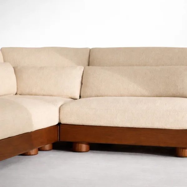 Teakwood base and leg detail of ivory L-shape sectional sofa