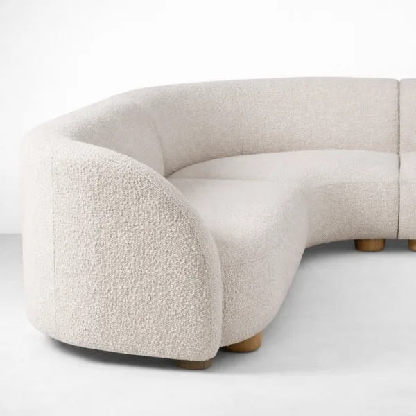 curved sectional sofa side profile with rounded arms and low base