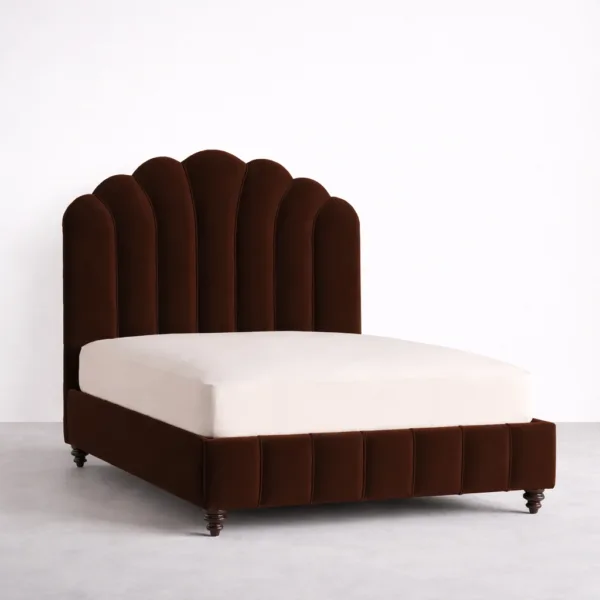 Brown upholstered bed with scallop panel headboard angled view