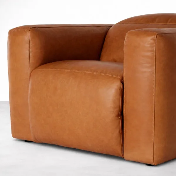 Close-up of cognac brown leather upholstery on INTERIORZE recliner chair