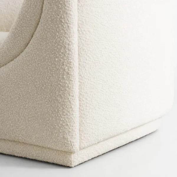 Close-up of INTERIORZE Arcline ivory boucle 2 seater sofa showing textured upholstery and clean wrapped base corner