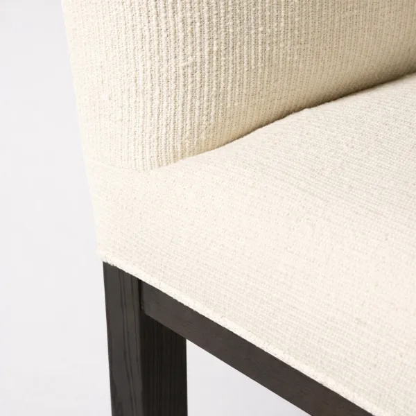 Close up of cream textured upholstery on INTERIORZE dining chair