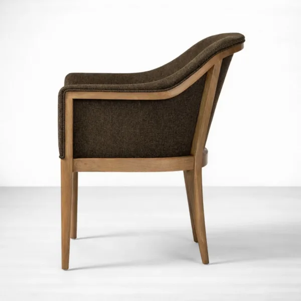 Side view of teakwood upholstered dining chair with curved back