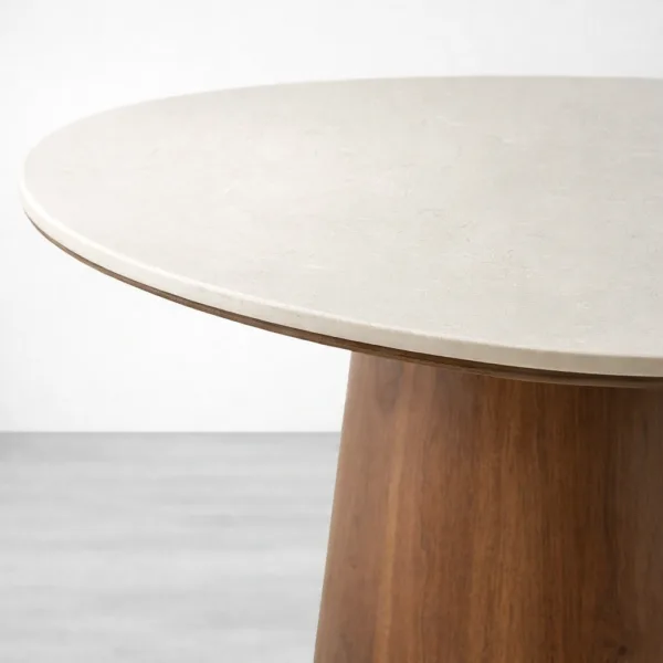 Side profile showing marble-look top and teakwood pedestal base of Aurora dining table
