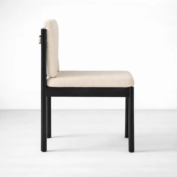 Beige upholstered dining chair side profile with black teakwood frame INTERIORZE Mono