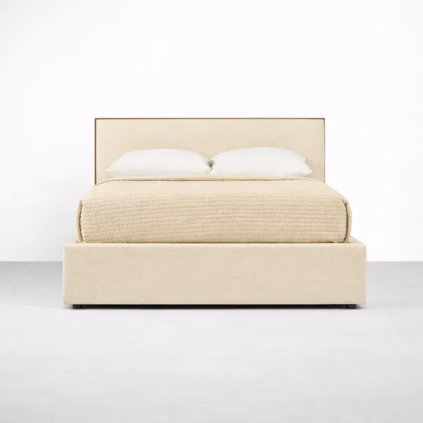 Front view of beige upholstered teakwood bed frame with padded headboard