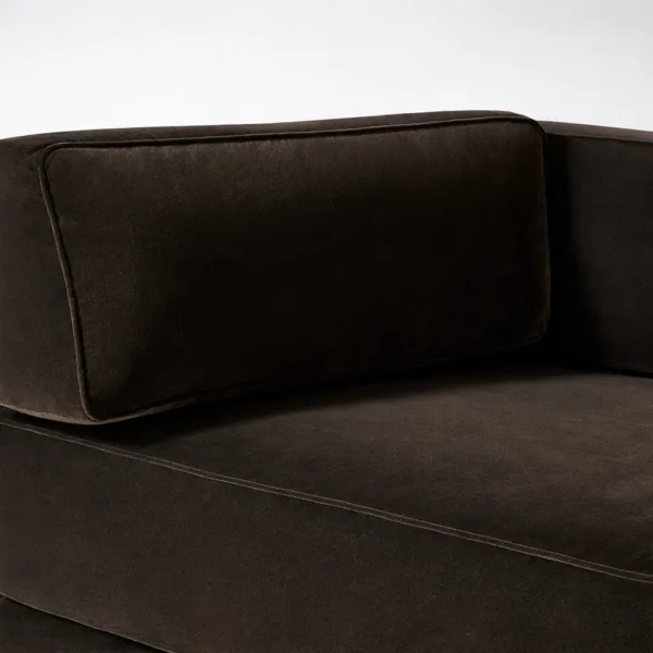 Close-up of dark brown sofa back cushion with smooth stitched finish