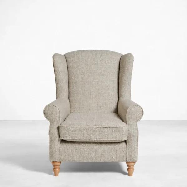 Beige wingback armchair with teakwood legs full view, INTERIORZE HERITAGEWING.
