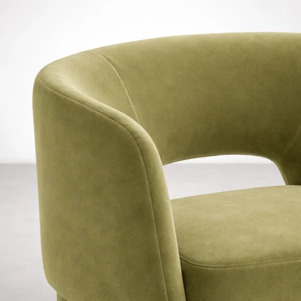 Close up of olive green velvet upholstery on INTERIORZE dining chai